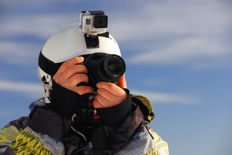 Skier with actioncamera and ordinary camera