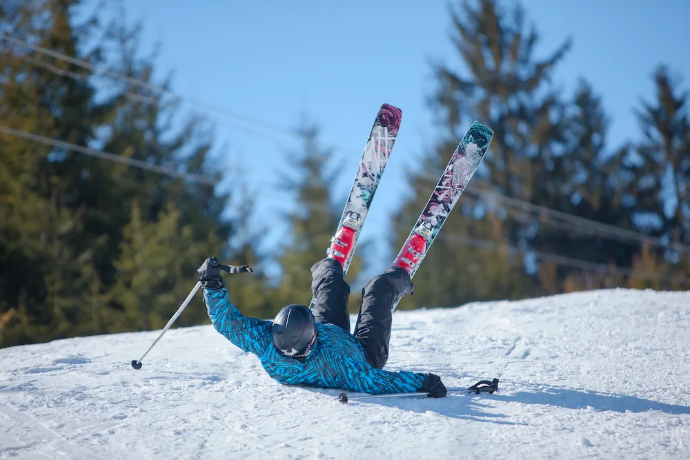 Skier down on his back after a fall