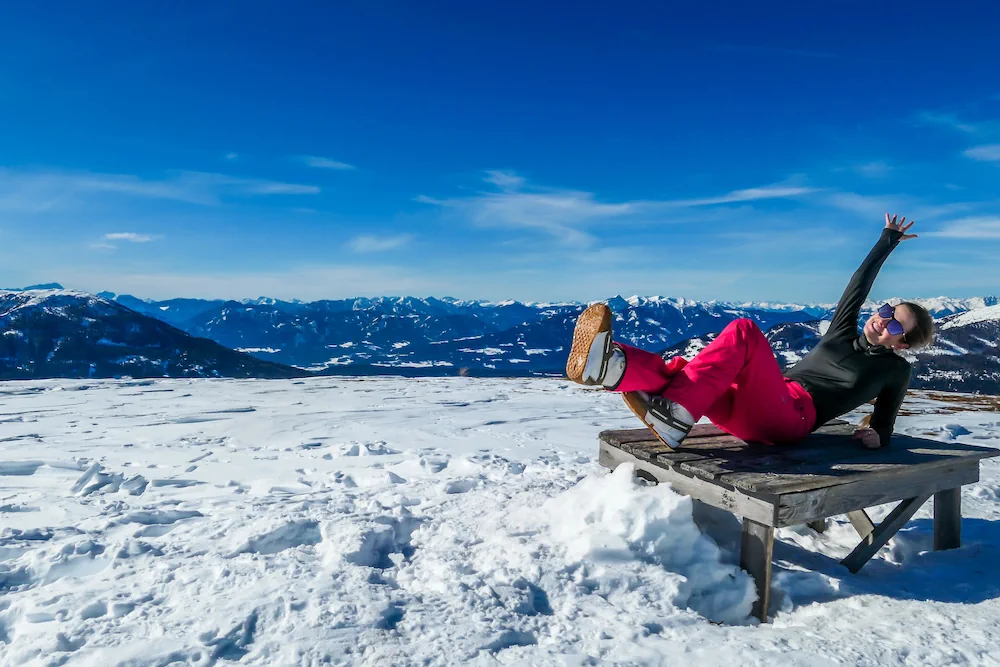 Ski girl warming up on bench