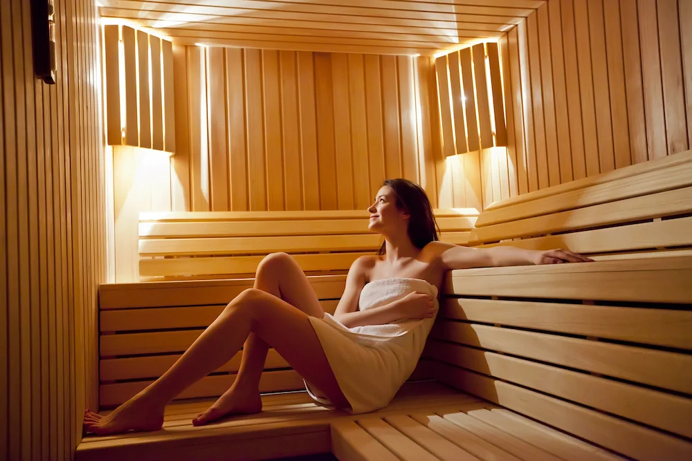 Woman enjoying a hot sauna